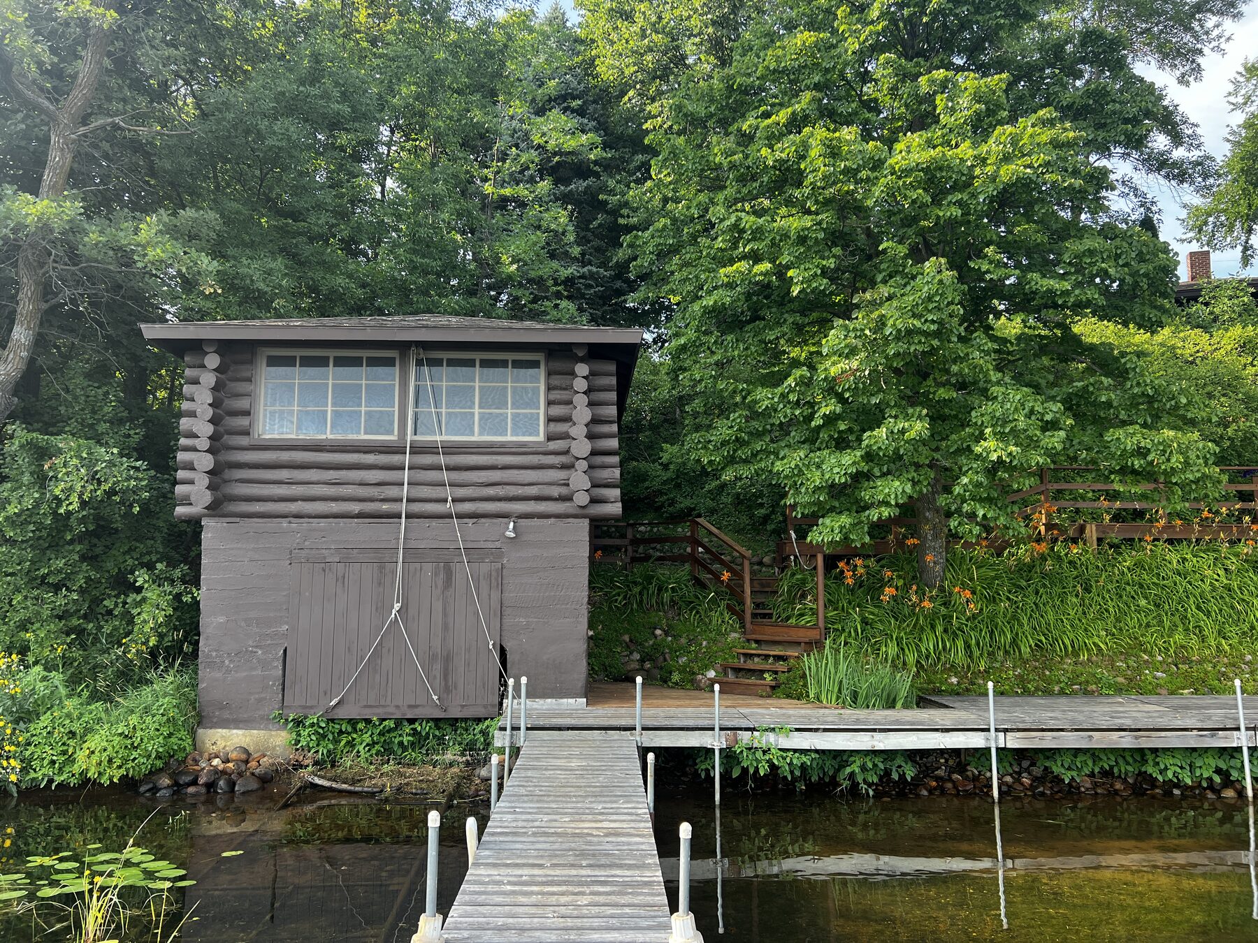 Log boathouse at the water's edge
