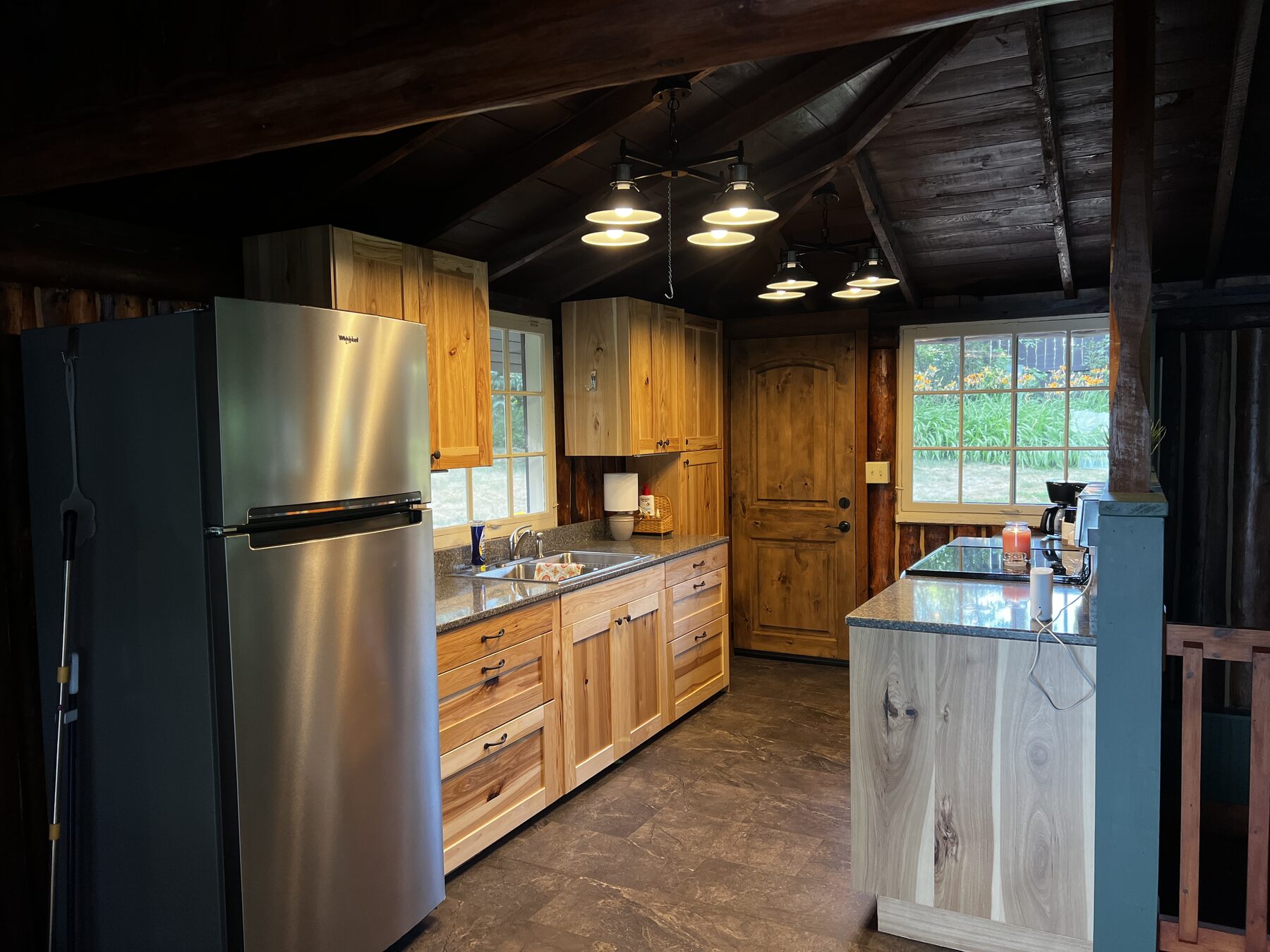Updated kitchen with wood cabinetry