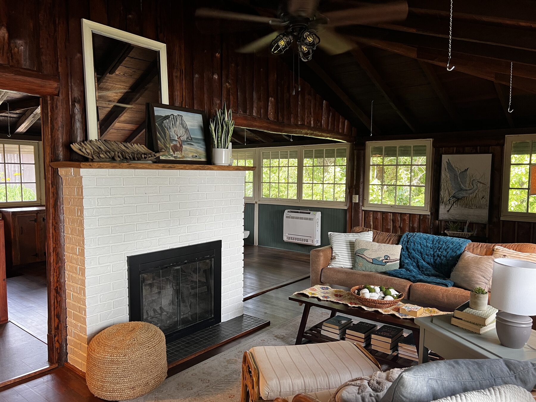 Living room with white brick fireplace
