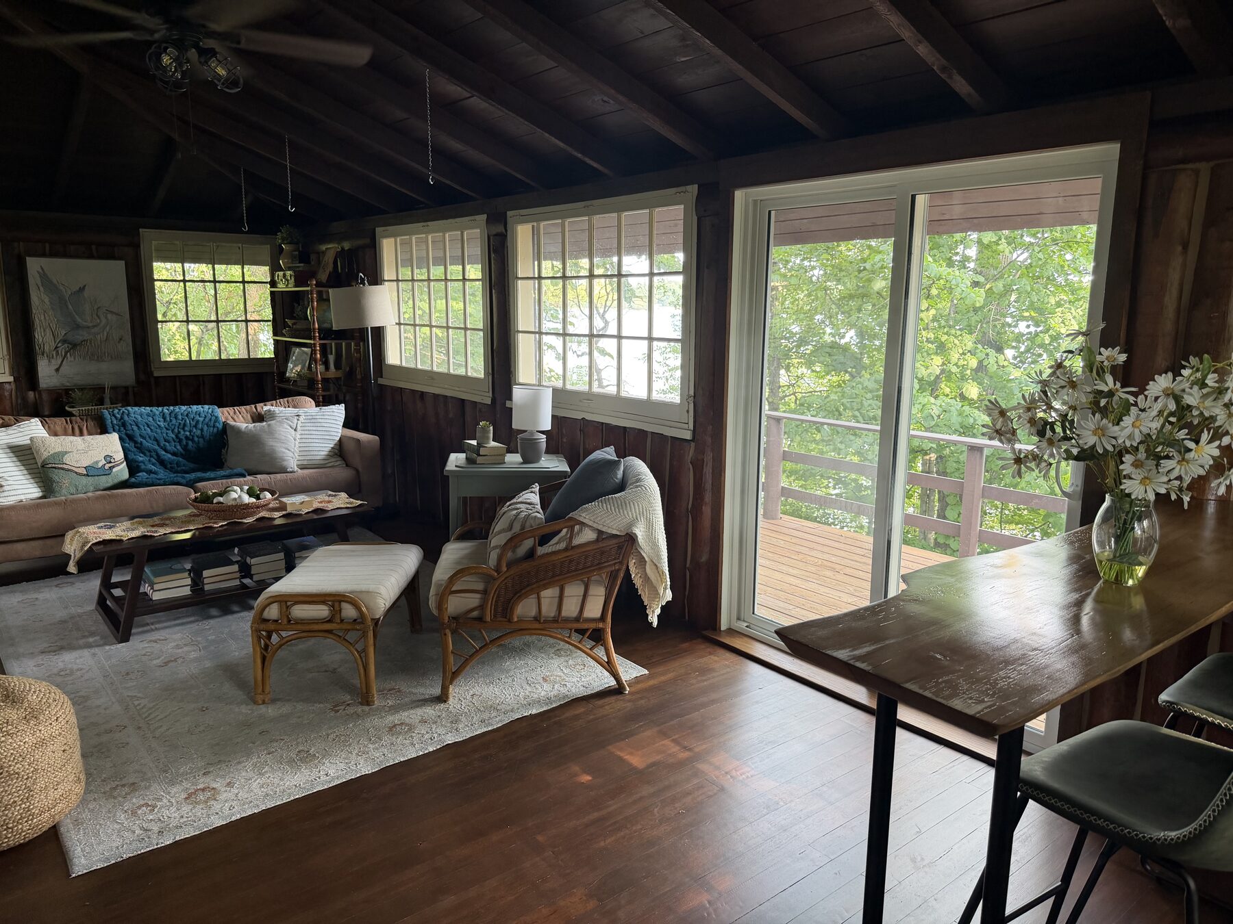 Sunroom with daisies and lake windows